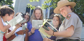 A park ranger on a walking tour in front of the historic Seamen's Bethel