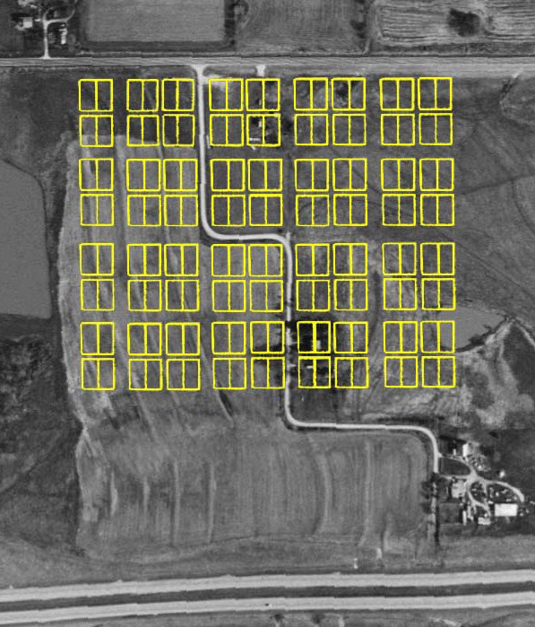 Aerial black and white photo of the New Philadelphia area. Many yellow rectangles are transposed on it showing plots of land.
