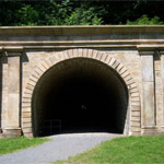 Staple Bend Tunnel was the first railroad tunnel in America, built for the Allegheny Portage Railroad.  Be advised, it is not at the main park unit, but rather near the town of Mineral Point, 5 miles from Johnstown. It is a roughly 5 mile round trip.