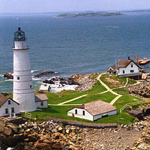 Aerial view of Little Brewster Island showing Boston Light, the light keeper's house, and two other outbulidings.