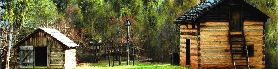 The Kitchen Cabin, Smokehouse and Tobacco Barn in the Distance