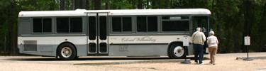 Jamestown Area Shuttle Bus load passengers at Historic Jamestown