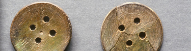 These buttons were buried with an individual in the African Burial Ground