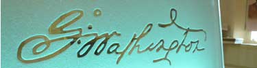 Photo of George Washington's signature on frosted glass