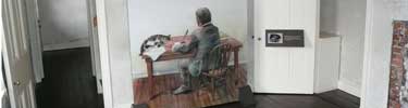 Photo of drawing of Poe and cat at desk