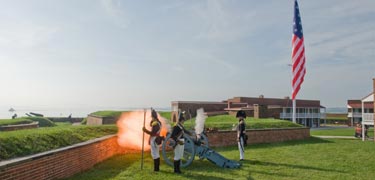 Fort McHenry Guard fires the fort's morning gun.