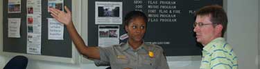 A Park Ranger assists a park visitor.