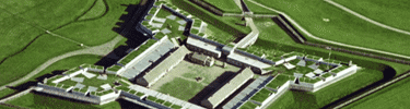 green and brown triangles from overhead form to make a large fort