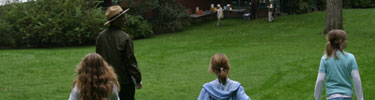 Three children on an adventure with a National Park Ranger at Olmsted National Historic Site