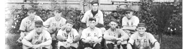 76th Coast Artillery Baseball team pose in front of Fort Hancock barracks c. 1905