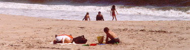 Visitors enjoying the surf at Jacob Riis Park beach in Gateway's Jamaica Bay Unit.