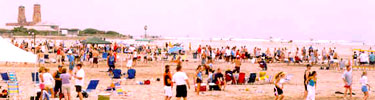 Beachgoers and volleyball competition at Gateway's Jacob Riis Park in Queens.