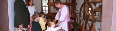 Volunteer Spinner with Children