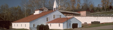 The massive Cast House with it's steeple is the core of the iron furnace operations.