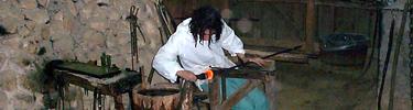 Glassblower working glass