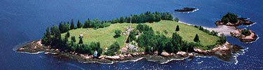 Saint Croix Island is surrounded by blue water.