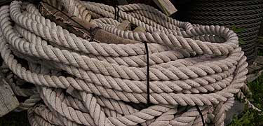 Coiled lines waiting to be put aboard the tall ship <i>Friendship</i>. NPS photo.