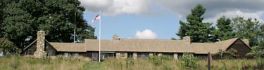 Dickey Ridge Visitor Center with blue sky and white clouds above.