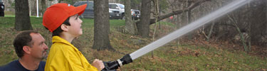 A child learns about fire fighting at National Junior Ranger Day