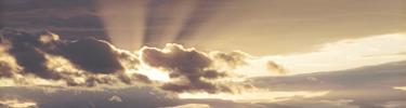 Rays of sun light filter through the clouds at sunset over the Shenandoah Valley.