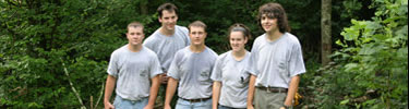 A group of sweaty YCC workers take a break for a group photo.