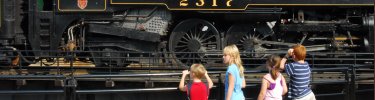 Four youngsters get to see a steam locomotive built in 1923 up close.