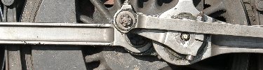 The drive rod, side rods and eccentric crank all meet at the main drive wheel pin. NPS Photo, Ken Ganz