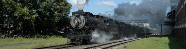 Canadian National 3254, a steam locomotive built in 1917, pulls a passenger train uphill. NPS Photo, Ken Ganz