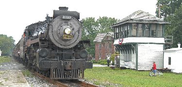 CP 2317 passes the old DL&W switch tower in East Stroudsburg on a Steamtown excursion. NPS Photo, Ken Ganz