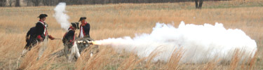 cannon firing demonstation with soldiers