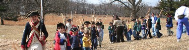 kids marching in a join the continental army junior ranger program