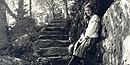 A girl stands along the stone steps of the Kurt Diederich Path in this historic image taken around 1920.