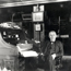 Thomas Edison sitting at his desk in his office and library. Link to information for the media.