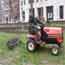 Photo of maintenance worker on mower
