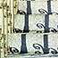 a detail of the custom house steps with the shadow of the railing