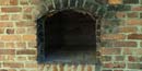 Picture of a brick and clay baking oven.