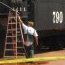 Black steam locomotive being prepped for new paint.