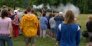 Visitors watch a musket firing program
