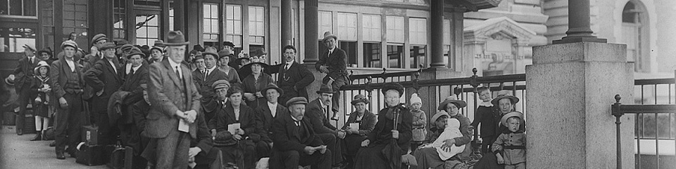 Immigrants awaiting inspection in front of Ellis Island's Main Building