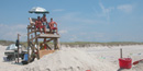 Lifeguard stand and rescue buoys are stationed on the beach. Lifeguard stand and rescue buoys are stationed on the beach.