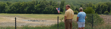 Visitors view the crash site and construction of the permanent memorial from the Western Overlook.