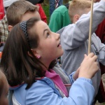 Girl loading pretend musket on field trip