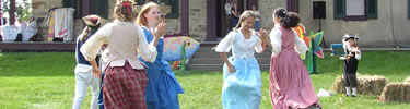 Girls dancing on lawn at Friendship Hill