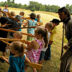 Children participate in a living history program