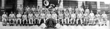 52nd Coast Artillery Band posing in front of Fort Hancock barracks c. 1938