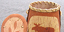A Passamaquoddy birchbark basket with the image of a moose on it A Passamaquoddy birchbark basket with the image of a moose on it