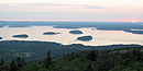 From atop Cadillac Mountain, the sun is just starting to rise over the Porcupine Islands. From atop Cadillac Mountain, the sun is just starting to rise over the Porcupine Islands.