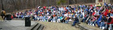 Zaborowski singing to hundreds of children