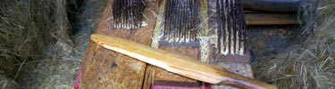 breaking up flax into fibers to make linen