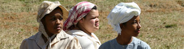 Costumed volunteers dressed as slaves.